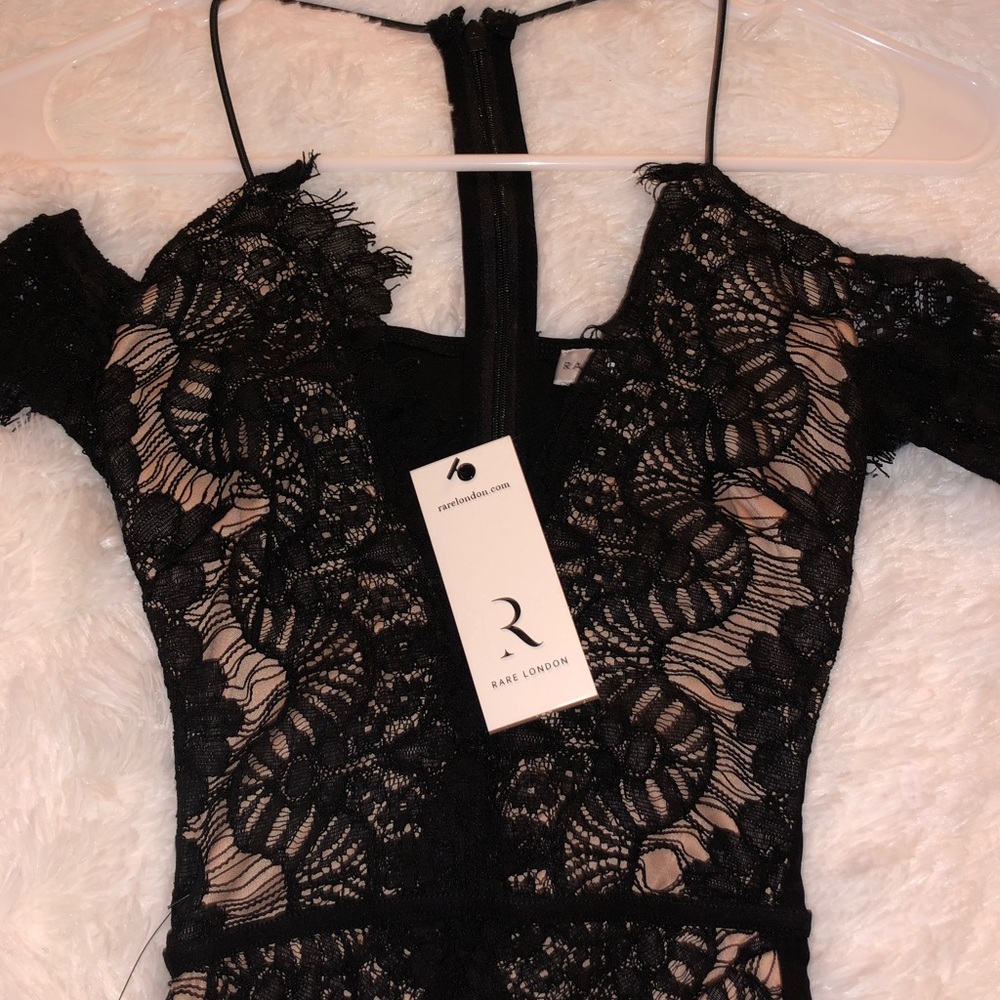 Little black dress with intricate lace detail.